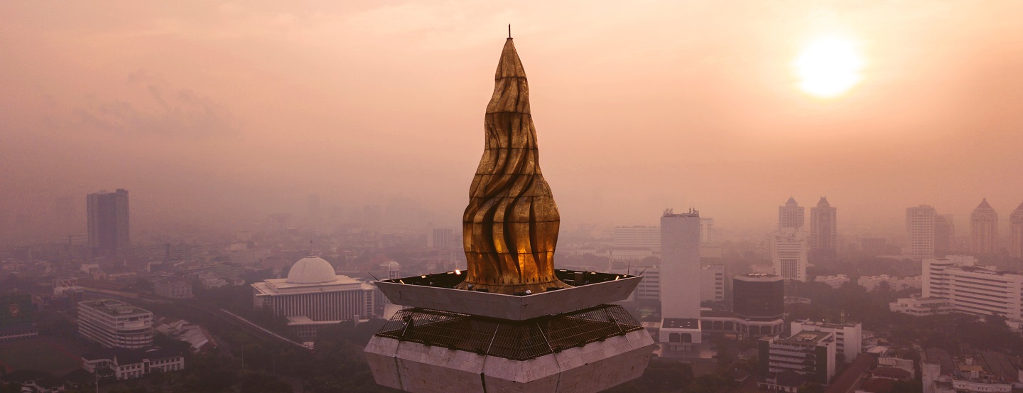 Sunset view of Jakarta’s National Monument’s gold-layered torch.