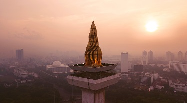 Sunset view of Jakarta’s National Monument’s gold-layered torch.