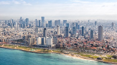 Sunlight washes over Tel Aviv’s strikingly modern coastline