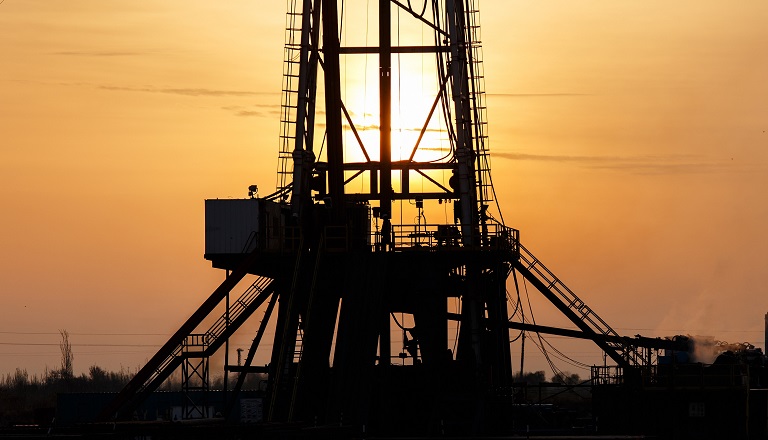 Sun sets over oil rig