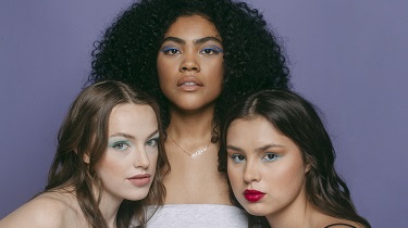 Three women of different skin types model Cheekbone Beauty cosmetics.