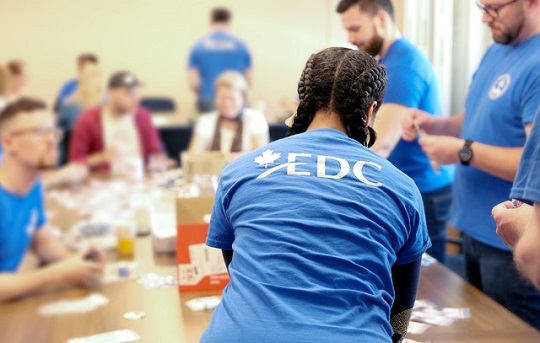 EDC employees engaged in educational and volunteering activities