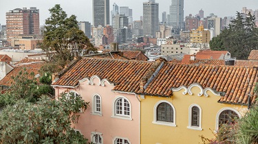 Old houses with new skyscrapers in Bogota, Colombia