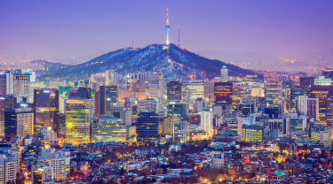 The skyline of Seoul, South Korea at dusk.