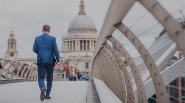 An entrepreneur crosses the Millennium Bridge in London, United Kingdom