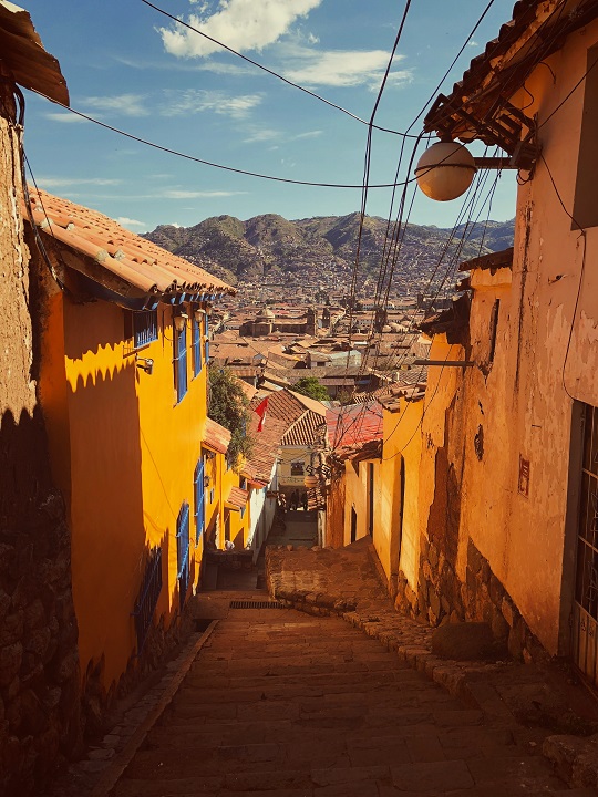 Back alley in Cusco Peru with mountain views
