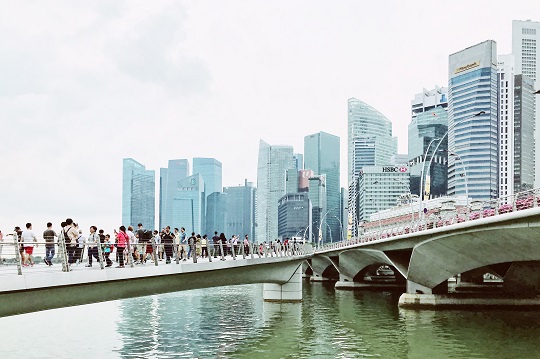 People crossing a bridge in Singapore