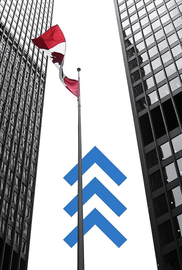 The Canadian flag waves in front of a tall office building