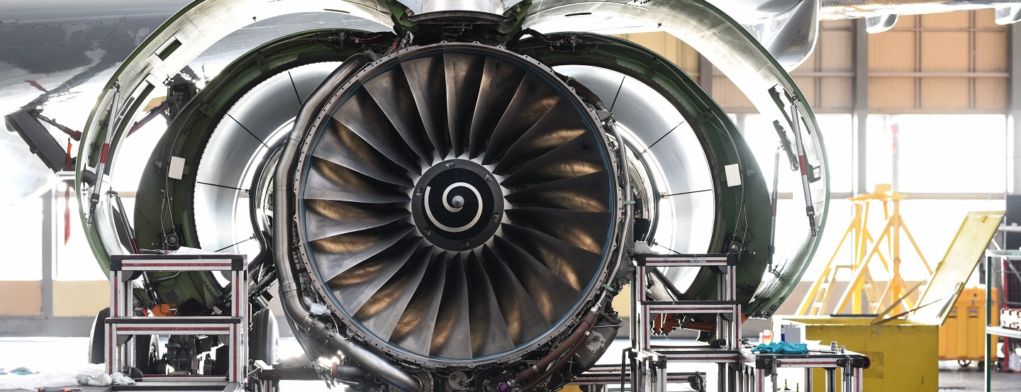  Aircraft jet engine maintenance in airport hangar 