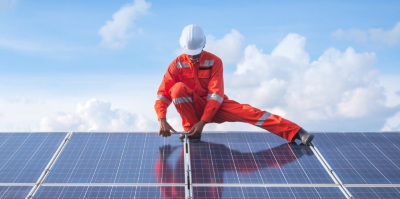 Technicians working on solar panels