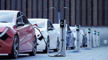 Row of electric cars being charged.