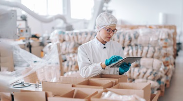 A woman in the medical supply industry looks at incoming orders.