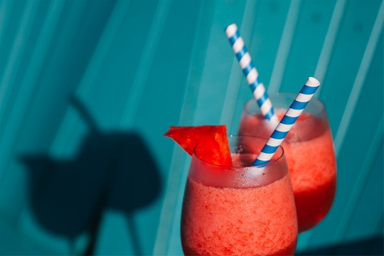 Striped paper straws in a frozen cocktail