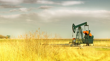 An oil well pumpjack in an oil field.
