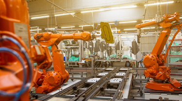 Automated equipment is operating in a factory.