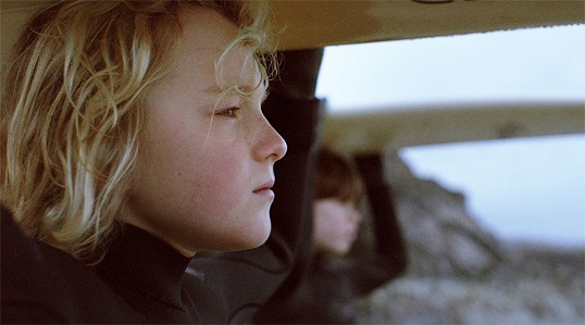 Young boys looking at the ocean