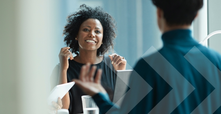 Black female co-worker at a business meeting with colleagues 