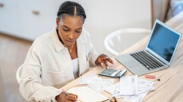 Business owner reviewing finances and cash flow needs.