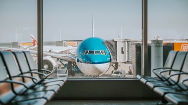 Empty airport, parked airplane highlights gloom