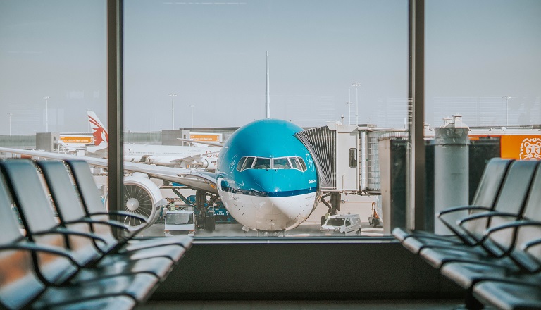 Empty airport, parked airplane highlights gloom