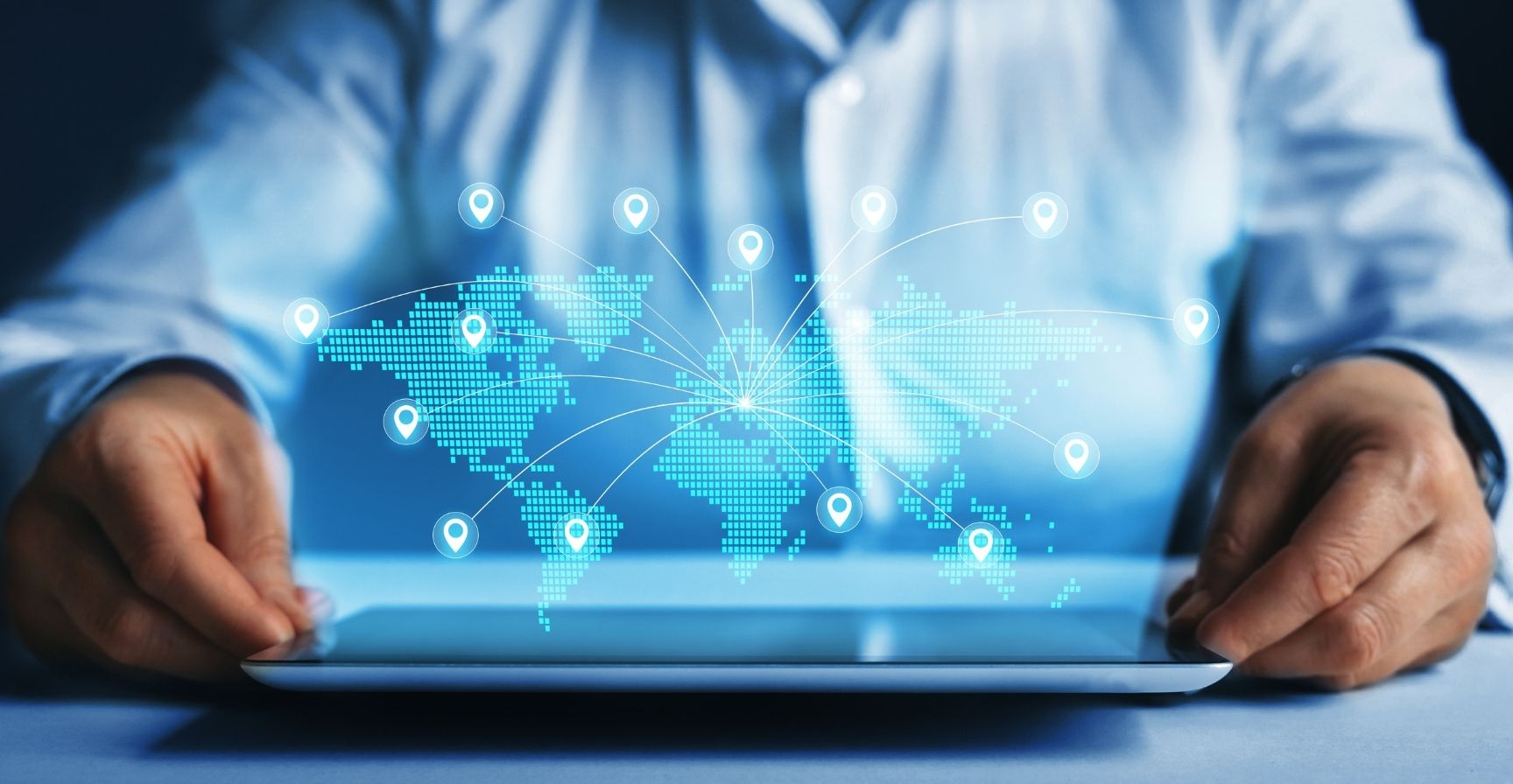 Businesswoman uses tablet with digital world map and global network connections, representing online trade and commerce.