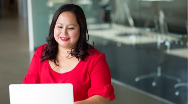 Indigenous woman working on a laptop