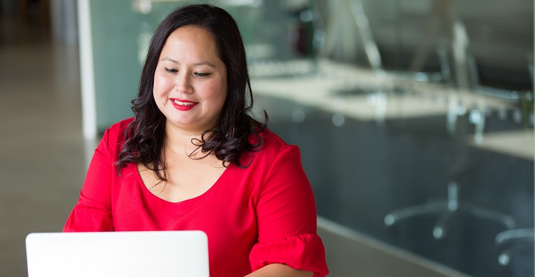 Indigenous woman working on a laptop