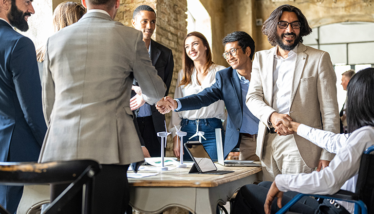 A group of people shaking hands