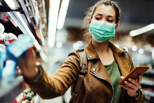 Female shopping in grocery store.