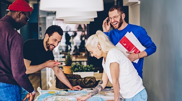 group of start-up employees looking at a map