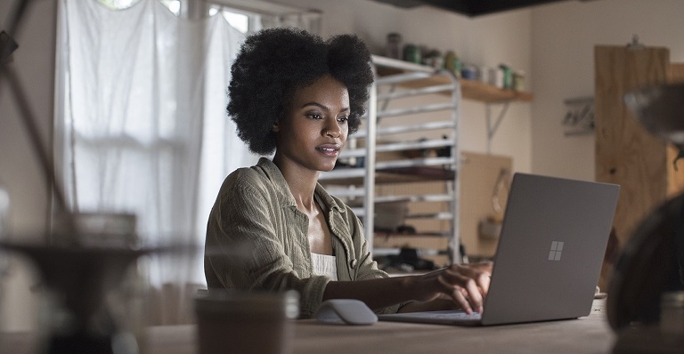 Woman works at a laptop