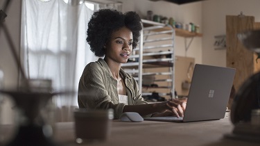 Woman works at a laptop