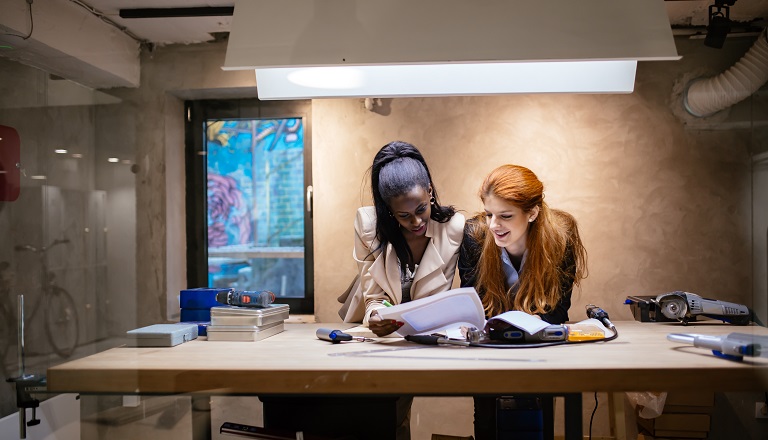 Female designers work in modern office 