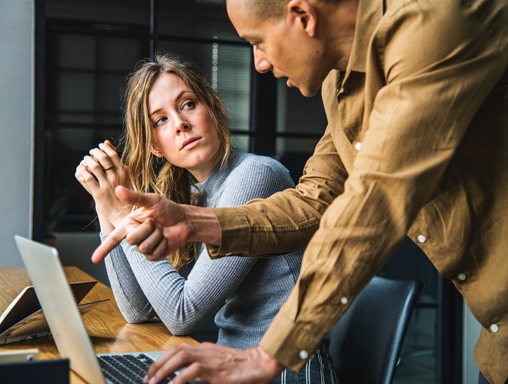 Stressed business partners navigate COVID impacts.