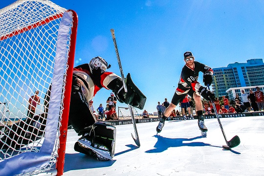 Hockey players using synthetic ice