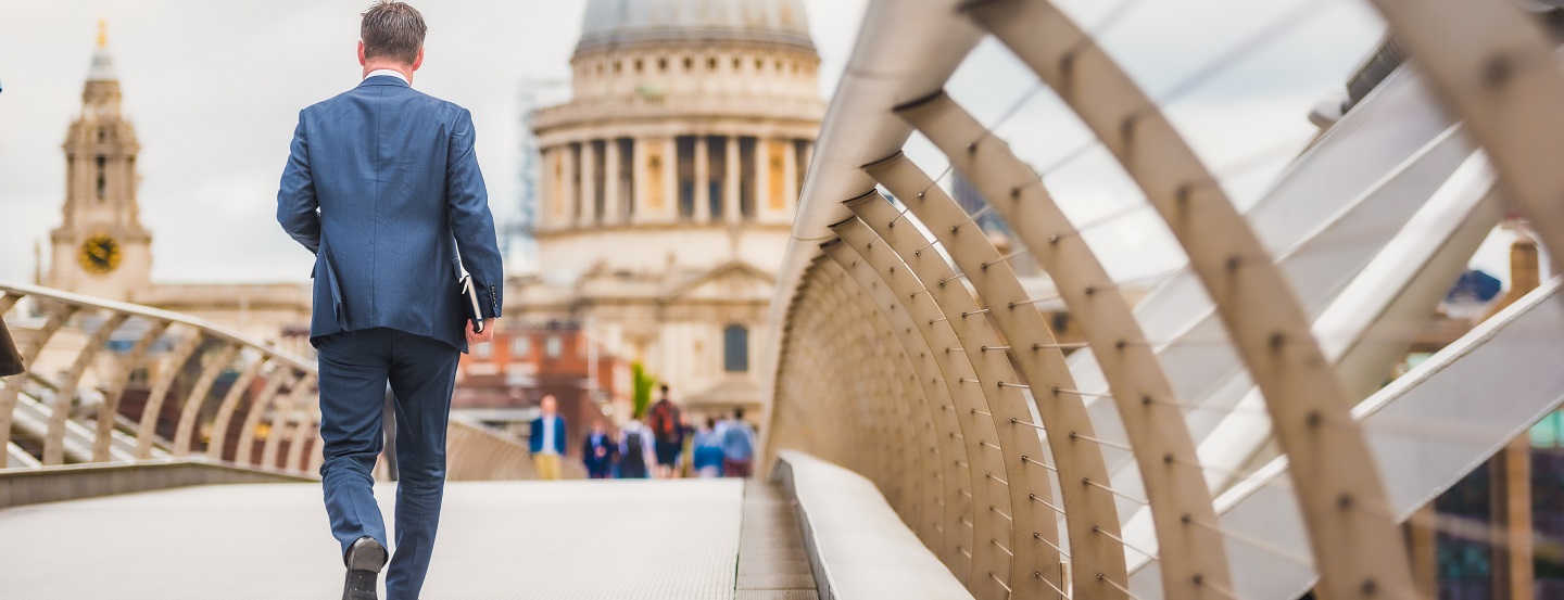 Canadian businessman walks to a meeting in a European capital.