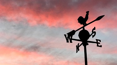 Weathervane in a red sky