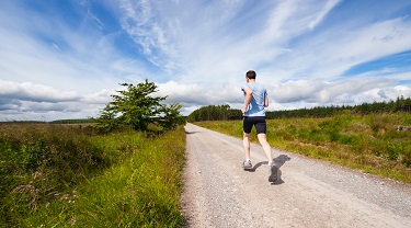 A man runs down a path.