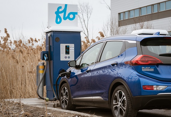 Electric car plugged into a charging station.