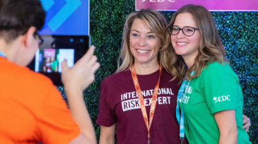 Two women being photographed at EDC event