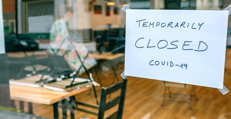 Closed sign in restaurant window