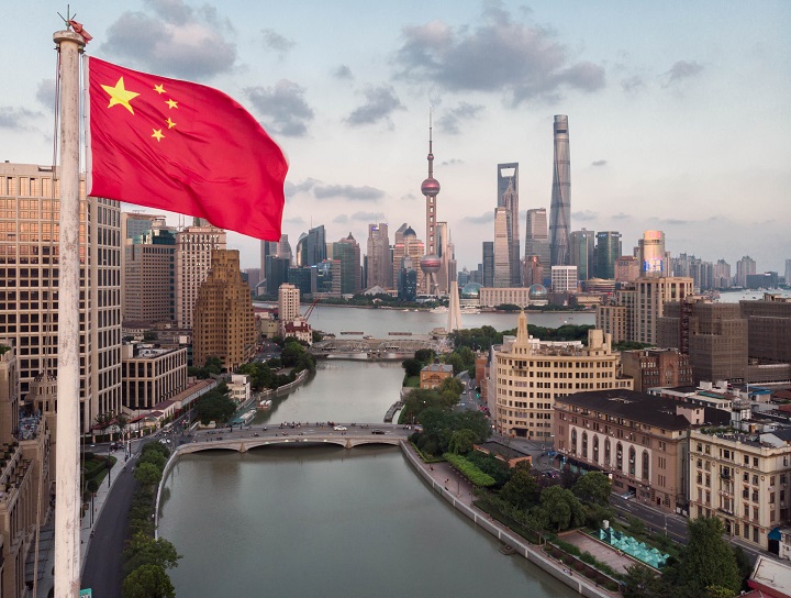 Chinese flag flies over river