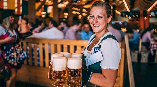Beer: Waitress serving beer during Oktoberfest