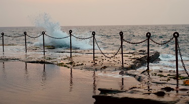 Chain fence across a beach