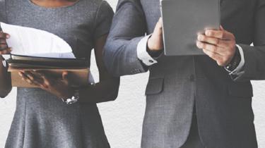 Group of people holding various digital devices: Canada needs an innovative and agile workforce