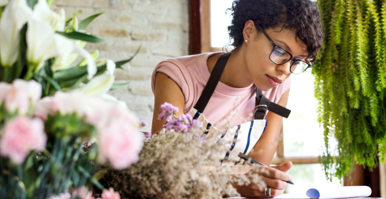 Female florist with pen