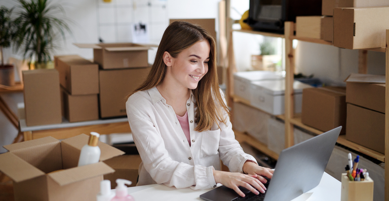 Entrepreneur in her business while talking on her mobile phone