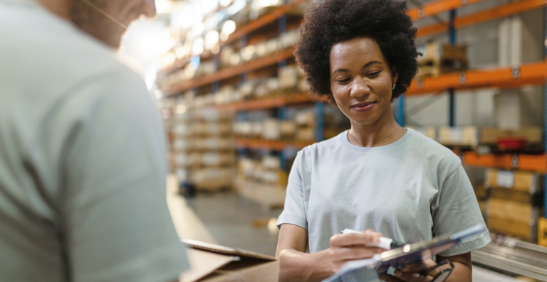 Woman in green top at warehouse