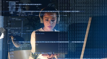 A software engineer sits at her desk.