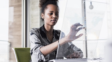 A businesswoman maps out her company’s strategy. 